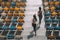 Two sportswomen running on stadium stairs