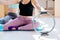 Two sporty women with perfect body having a training with pilates rings sitting on mats in modern studio interior