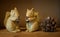 Two squirrel dolls with pine cones
