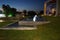 Two-stage rectangular fountain with illumination in the evening. Kolympia, Rhodes, Greece