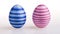 Two standing Easter eggs striped in male blue and female pink color on white background