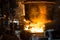 Two steelworkers pours liquid metal into molds from tank
