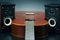 Two stereo audio speakers and classical acoustic guitar