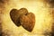 Two stone hearts on grunge texture