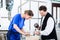 Two Stonemasons carving pillar out of stone in workshop