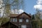 Two-storey wooden country cottage. Summer rest. Comfortable cottage for a family vacation