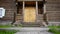 Two-storey wooden house, view of the front porch and veranda. HD