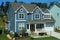 Two-story, blue, suburban home in a neighborhood in North Carolina