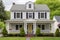 two-story dutch colonial house with squared symmetrical features