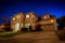 A two story home against a starry sky