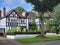 Two story houses with Tudor style trim