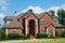 A two story traditional brick home with detailed landscaping awaits owners arrival