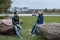 Two students sitting and talking, city landscapes and buildings in the background