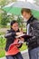 Two students under umbrella