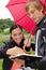 Two students under umbrella