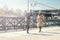 Two students walk on the street and play hopscotch on the asphalt, youth, childhood