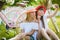 Two stylish teenage girlfriends on bicycle. Best friends enjoying day on bike