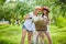 Two stylish teenage girlfriends on bicycle. Best friends enjoying day on bike