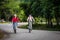 Two stylish young girls cycling along the road`s best friend enj