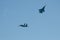 Two SU-27 aircraft of the aerobatics group `Russian knights` in the sky