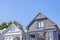 Two suburbs houses in San Francisco, California with gable roofs against the clear sky