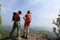 Two successful backpacker enjoy the view at seaside mountain