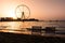 Two sunbeds with Ain Dubai ferris wheel view at JBR beach