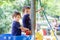 Two sweet boys, brothers, playing in a boat on the playground