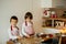 Two sweet children, boy brothers, preparing gingerbread cookies