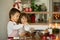 Two sweet children, boy brothers, preparing gingerbread cookies