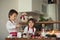 Two sweet children, boy brothers, preparing gingerbread cookies