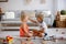 Two sweet children, siblings, playing with trains at home