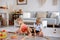 Two sweet children, siblings, playing with trains at home