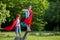 Two sweet little preschool children, boys, playing superhero in