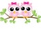 Two sweet owls sitting on a branch