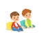 Two sweet smiling little boys sitting on the floor leaning on a pillows, colorful character