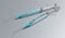 Two syringes isolated on grey background