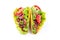 Two taco shells isolated on white, with lettuce, ground beef meat,  mashed avocado, tomato, red onion and jalapeno pepper