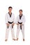 Two taekwondo athletes standing over white background