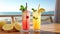 Two Tall Colorful Cocktails with Beach in Background