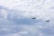 Two Tandem Rotor Helicopters in a Cloudscape