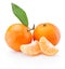Two tangerines with leaves and peeled pieces on white background