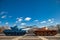 Two tanks with crossed guns, against the blue sky. Two tanks blu