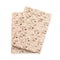 Two tasty crispbreads on white background, top view