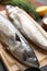 Two tasty salted mackerels on table, closeup