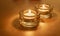 Two Tea Light Candles in Glass on Gold