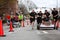 Two Teams Race Beds On City Street