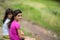 Two teen sisters sitting outdoors