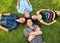 Two teenage couples relaxing on the grass