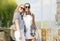 Two Teenage Girlfriends Together. Posing Against Fountain in Park Outdoors